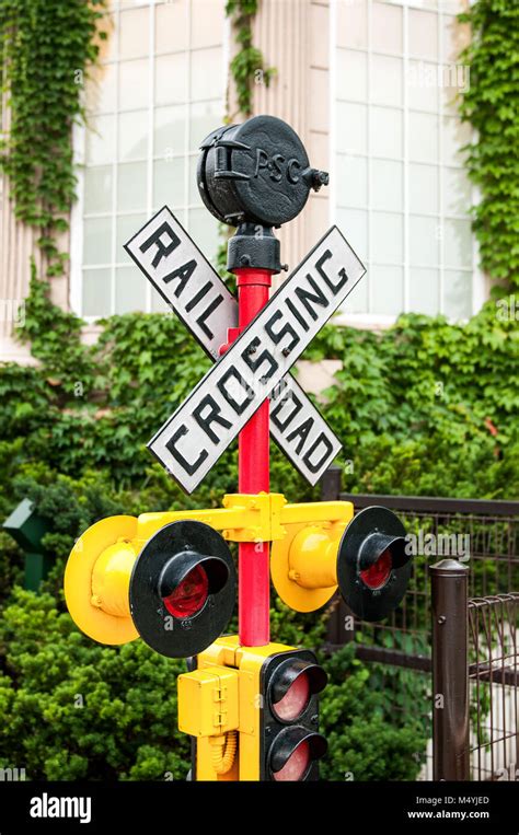 yellow railroad crossing sign Stock Photo - Alamy