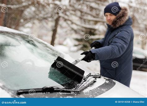 Man Removing The Snow From His Car With A Brush Stock Photo Image Of