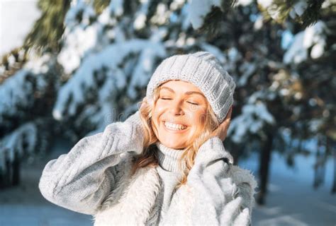 Happy Blonde Woman In Winter Clothes Hands Near Face In Snowy Winter Forest Stock Image Image