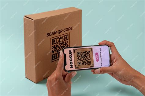 Premium Psd Person Scanning Qr Code On Cardboard Box With Smartphone