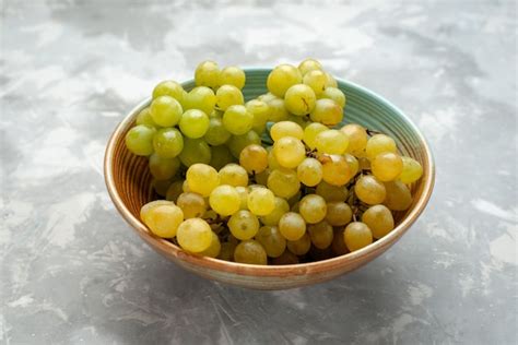 photo fresh green grapes  plate  light