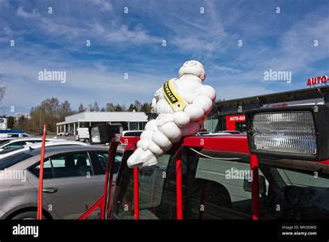 Michelin man mascot on a car Stock Photo - Alamy