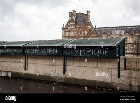 A Bouquiniste Stand Is Seen With A Protest Slogan Reading Olympic