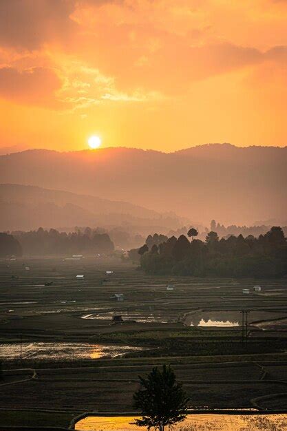 Premium Photo Sunrise Over Mountains With Country Side Farming Fields