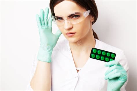 Sexual Health A Doctor In A White Coat Holding A Pill For A Healthy