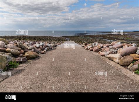 Public Slipway With Stones In The Low Tide On Parton Beach Cumbria