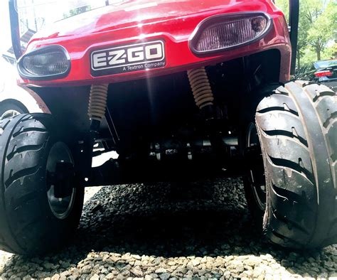 The Front End Of A Red Four Wheeled Vehicle