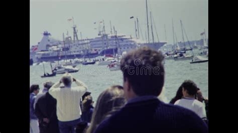 United Kingdom 1994 Aircraft Carrier Between Boats Stock Footage