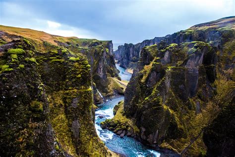 Fjaðrárgljúfur, a canyon in Iceland; there's a path leading right down ...