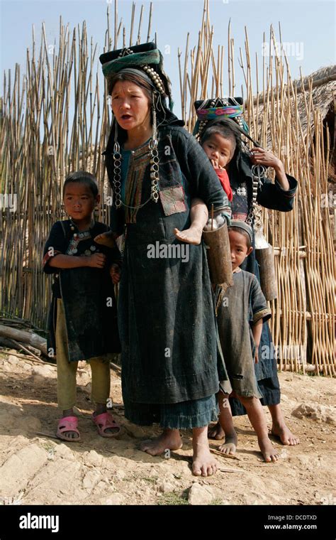 Ethnic Akha Woman And Children In Tribal Village Near Phongsali Laos