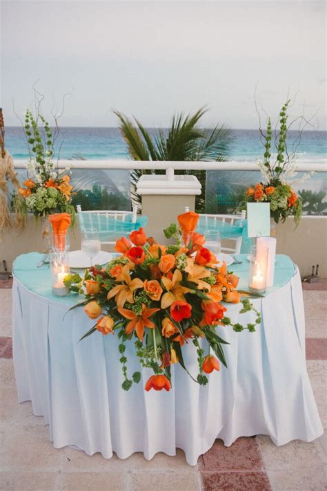 Bright Beachy Tangerine Flower Arrangements At Cancun Wedding