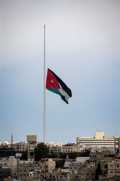 Large Flag of Jordan in Amman City with the Skyline View Stock Image ...