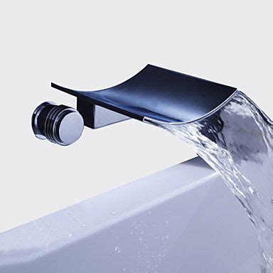 A Faucet With Water Running From It S Spout Into A Bathtub