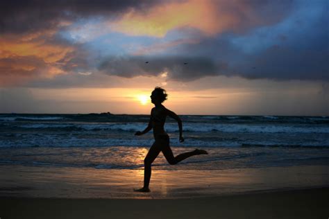 Running girl at sunset silhouette — Stock Photo © sdecoret #52812125