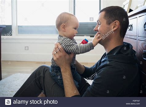 Father Holding Baby Son Stock Photo Alamy