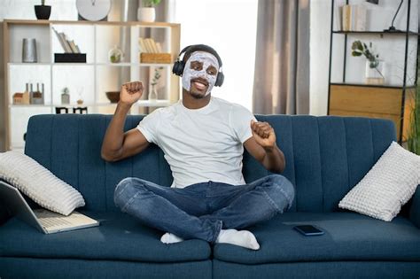 Premium Photo Relaxed African American Man With White Clay Mask