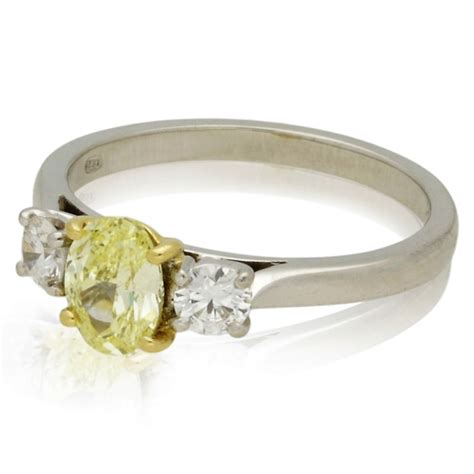 PRE-OWNED PLATINUM 3 STONE DIAMOND RING. NATURAL INTENSE YELLOW DIAMOND ...