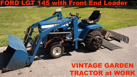 Ford Lgt 145 Garden Tractor Front End Loader And Landscape Rake At Work Youtube