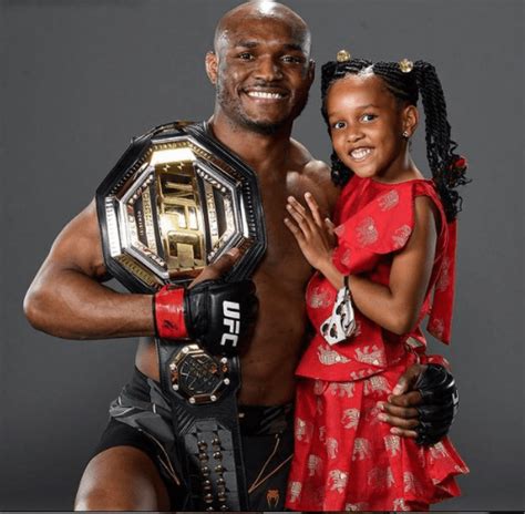 Cute Photo Of Kamaru Usman And His Daughter Posing With His Belt