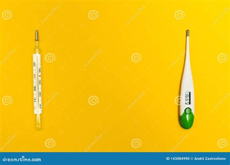 Analog And Digital Thermometer On A Yellow Background With Space For