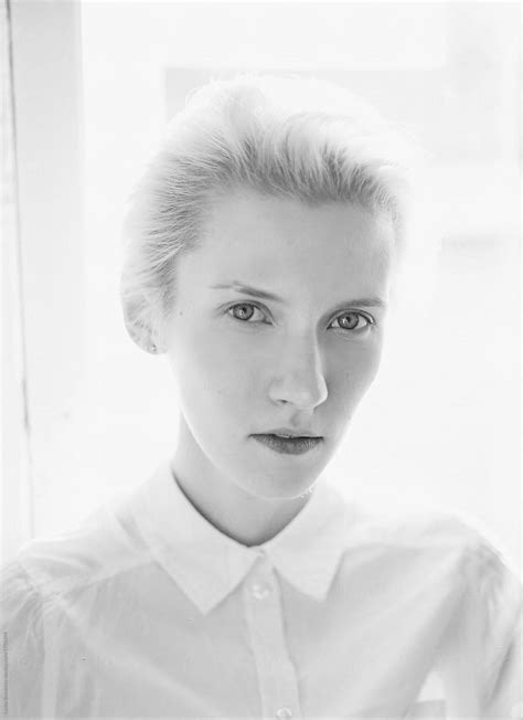 Black And White Portrait Of Young Woman Looking At Camera Del