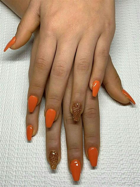 Beautiful Orange Fall Nails In Coffin Shape With An Accent Glitter Nail