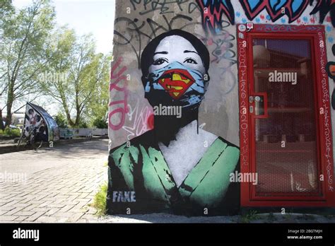 Graffiti ’Super Nurse” by artist FAKE on April 21, 2020 in Amsterdam ...