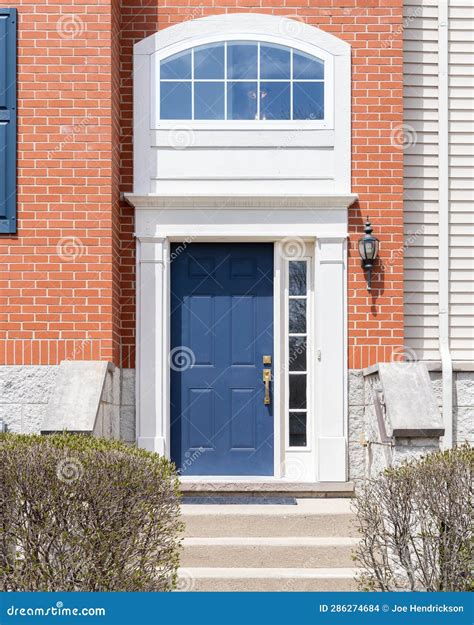 A Blue Front Door on a Red Brick Home. Stock Photo - Image of detail ...