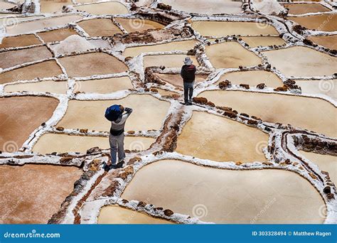 Workers In Salt Evaporation Ponds Maras Sacred Valley Cusco Region