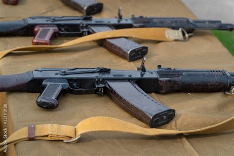 Kalashnikov assault rifles on the table Stock Photo | Adobe Stock