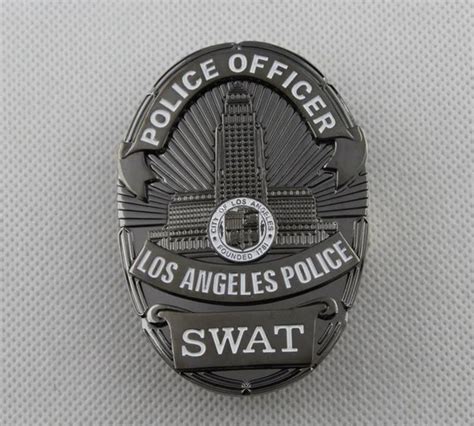 a police badge is shown on a white surface