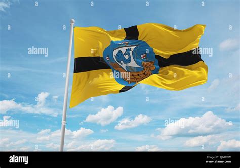 Official Flag Of Wellington City New Zealand At Cloudy Sky Background