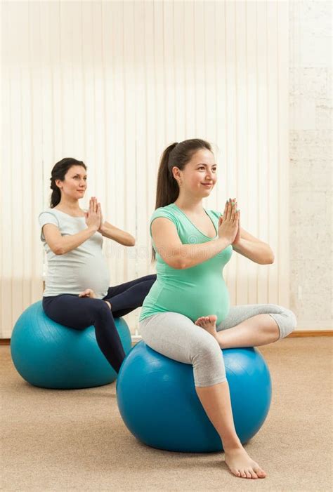 Beautiful Pregnant Women Doing Yoga On The Balls Stock Photo Image Of