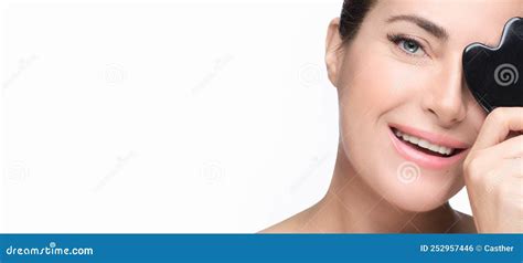 Closeup Of Smiling Woman Face With Luminous Healthy Skin Displaying A