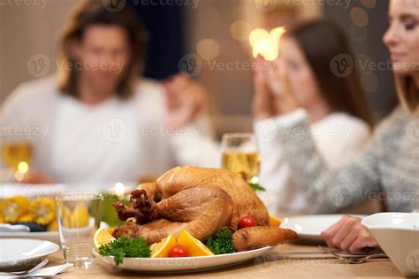 Beautiful family praying over festive dinner at home 15770516 Stock Photo at Vecteezy