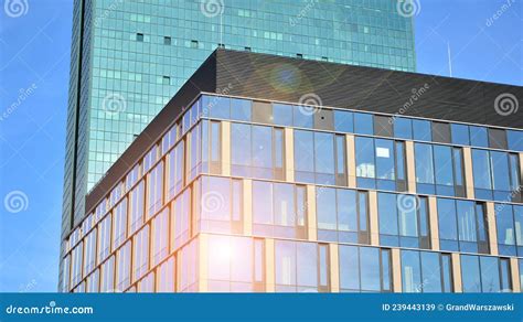 Modern Office Building With Glass Facade On A Clear Sky Background