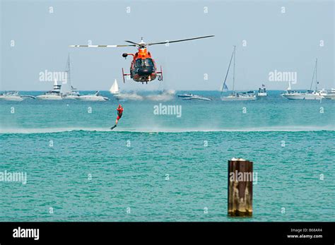 U.S. Coast Guard Helicopter & Boat Rescue / Lifting rescue swimmer out ...