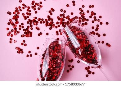 Two Champagne Glasses Spilling Red Glitter Stock Photo 2230730747