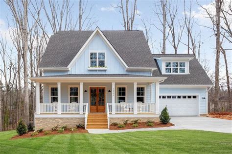 A House That Is In The Middle Of Some Grass