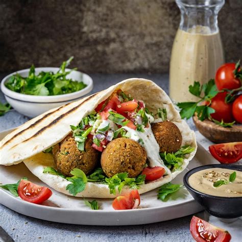 Premium Photo Falafel In Pita Bread With Chopped Tomato Salad And