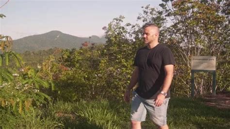 Tracking Shot Of Man Walking Left Along Stock Video Pond