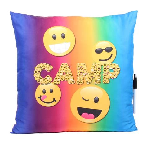 A Colorful Pillow With Embellishments And Smiley Faces On It That Says Camp