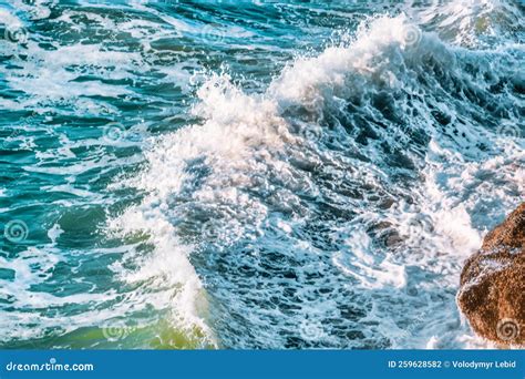 Beautiful Waves Of The Pacific Ocean Beat Against The Rocky Shore