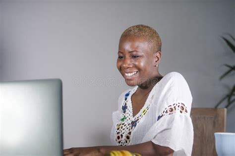 Attractive And Happy Hipster Afro American Woman Working On Laptop