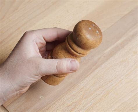 Hand Putting Some Salt Shaker Stock Photo Image Of Horizontal