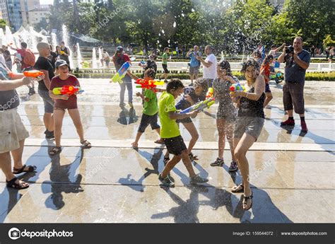 Water gun fight summer — Stock Editorial Photo © Belish #159544072