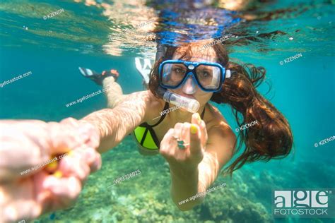 Snorkelling Woman In Yellow Bikini Makes Tempting Gesture In Ocean