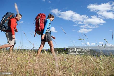 Women Walking Through Tall Grass Photos And Premium High Res Pictures