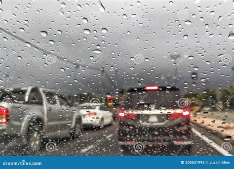 Road View Through Car Window Blurry With Heavy Rain Stock Image