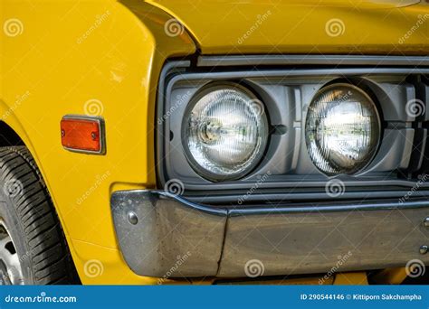 Front Of Classic Retro Car Yellow Car Tires And Circle Headlight Car